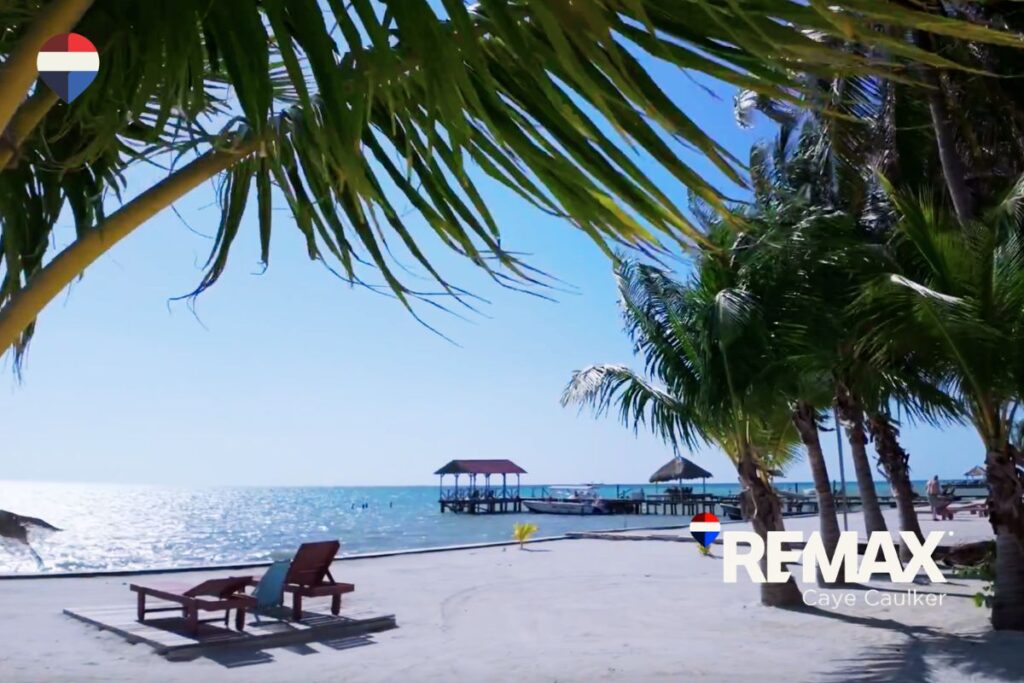 Ocean-view lot or beachfront property with clear blue water and dock access